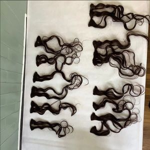 Curly brown genuine human hair clip-in extensions